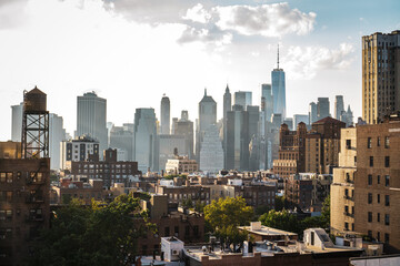 View of financial district Manhattan skyline and Brooklyn buildings at sunset