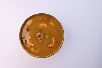 Parippu Payasam Pradhaman or Moong Dal Kheer Indian sweet Kerala food for Onam festival special dessert Mithai for Onam sadya , sadhya in green banana leaf background. Also popular Sri Lankan food .