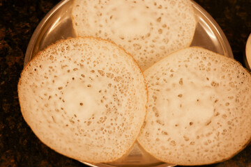 Appam, Kerala breakfast food egg curry or hot and spicy chickpea Masala and milk tea chai,...