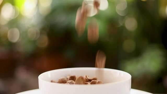 Chocolate cornflakes poured into a white bowl breakfast cereal cocoa Quick and easy healthy meals for the morning.
