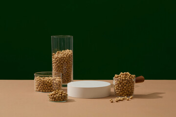 Several glasses filled with soybeans are displayed around an empty podium. Mock-up for exhibitions...