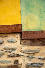yellow, green and stone wall, wall of historical house