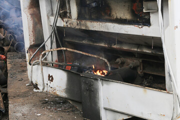 Scrap metal is disposed of by fire.
