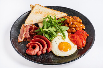 traditional breakfast on the black plate