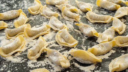 A kind of ravioli, casoncelli, home made traditional food of the Bergamo area, Italy. Delicious Italian food. Black background