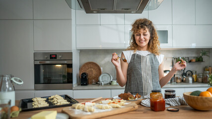 Woman caucasian female prepare breakfast croissants dough at kitchen