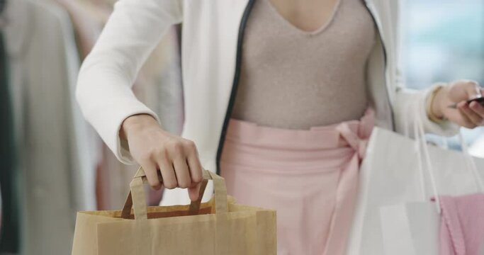 Shopping bag, hands or machine with credit card by customer at checkout transaction on electronic pos. Boutique closeup, mall or lady paying to purchase at fashion store for retail sale or discount