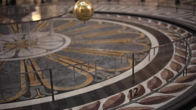 Foucault Pendulum in Paris Pantheon landmark building. Pendulum showing the Earth moving around its axis.