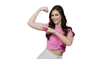 Cheerful young woman flexing arm muscles, showing strength standing against transparent background.
