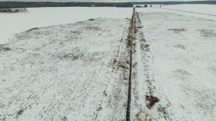 Drone photography or rural farmland covered by snow and ice during winter day © M
