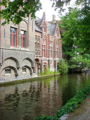 Fototapeta na wymiar View of houses and river on a summer day. Brugge. Belgium.