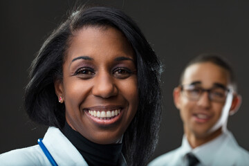 Medical professional beams, partner's silhouette gently fades