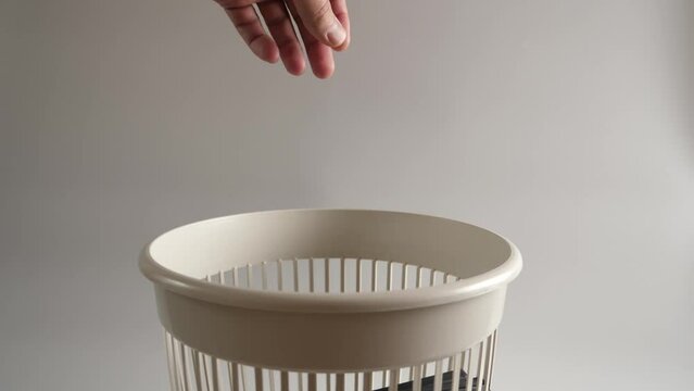 The plastic of the CD box is thrown into the trash for recycling