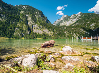 View to Königssee lake at Berchtesgaden with a nature boat pier and the Watzmann mountain chain at...