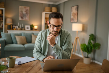 one man adult caucasian work on laptop at home happy smile