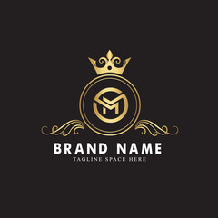 letter M ornamental logo concept with golden crown