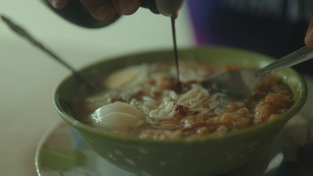 Batchoy, A Filipino Delicacy Being Mixed and Ready to Eat. 