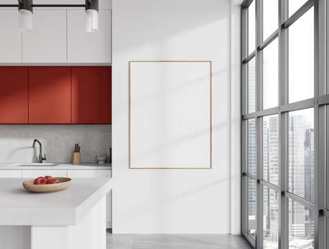 White and red kitchen interior with island and poster, close up