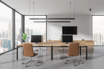 Dekokissen Office interior with desk and pc monitors in row, tv screen and panoramic window © ImageFlow