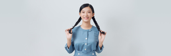 Smiling pretty woman makeup and hairstyle with pigtails
