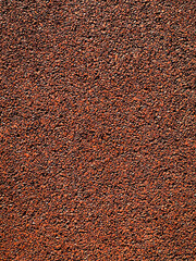 Grunge red wall.  red rubber coating rubber for the road. protective red coating of crumb rubber....