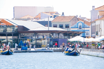 The central canal of Aveiro in Portugal - 703755304
