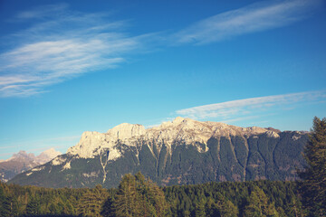 Mountain landscape in spring. The mountain is covered with snow. Vallaccia Peak. San Giovanni di Fassa, Trentino, Italy