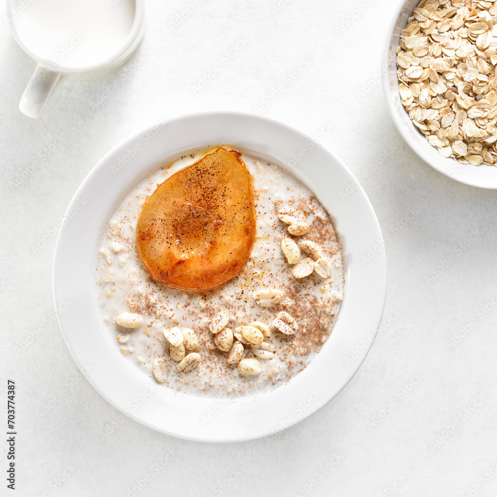 Wall mural Oat porridge with caramelized pear and peanut