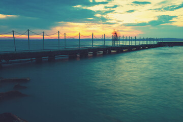 Fototapeta premium Pier on the lake Balaton at sunset. Siofok, Hungary