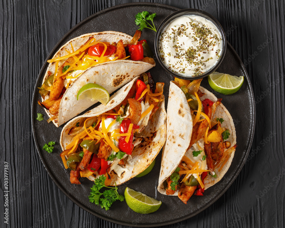 Sticker baked tex-mex chicken fajitas on a plate, top view