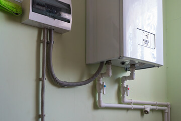 an electric boiler is installed on the wall, heating of a private house.