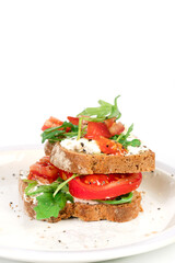 Sandwiches with soft cheese and herbs and tomatoes