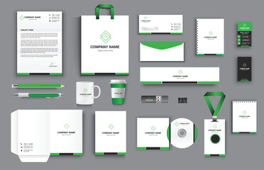 office business stationary set in green black white color vector design with letter head envelop folder id card notepad dvd cover usb paper clip pen pencil cups business card shopper