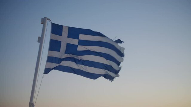 A greek flag waving in the wind
