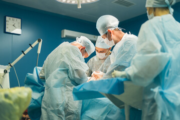 Doctors surgeons perform an operation in a hospital