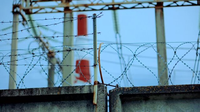 Prison razor wire fence . Barbed wire on restricted object	
