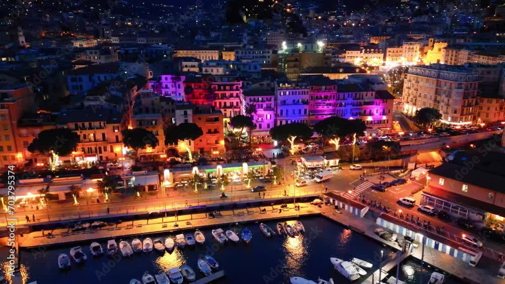 Sticker Aerial view of Sanremo at night, Italy. Port and city buildings