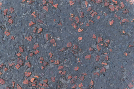 imagen detalle textura suelo de cemento y grava roja 