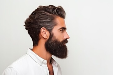 profile view portrait shot hipster beard male man stylish hair style studio shot on white background wall