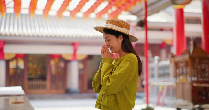 Woman pray for herself in Chinese temple