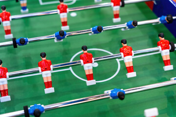 Young people playing table football game