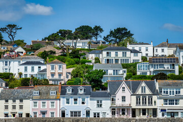 Fototapeta na wymiar St Mawes, Cornwall - Houses on the hillside above the harbour of St Mawes on the Roseland Peninsula.