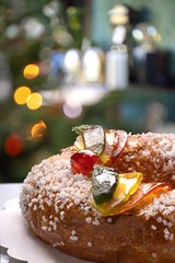 Close up shot of a brioche, galette des rois showing candied fruit and sugar.