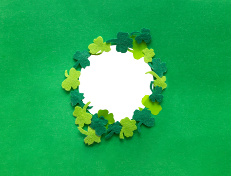 A round clover frame on a green background, designed as a postcard for St. Patrick's Day. A clover frame isolated png transparent.