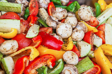 Salad of fresh vegetables, tomatoes, zucchini, eggplant and mushrooms.