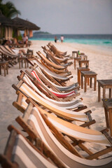 Sunbeds on a beach at sunset