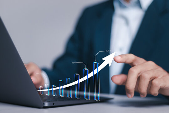 Investment strategy planning. Businessman use computer laptop with analyzes financial growth graph for long-term investment, Financial goals and global economic business planning.