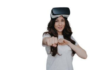 Woman with wavy hair in white t-shirt with vr glasses on her forehead looks at camera against transparent background, imitating punch by hands hands, satisfied by virtual reality game