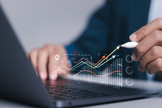 Investment strategy planning. Businessman use computer laptop with analyzes financial growth graph for long-term investment, Financial goals and global economic business planning.