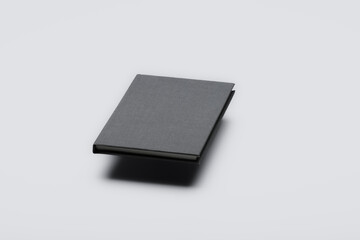 Blank hard cover floating book isolated on white background